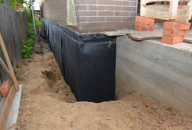 Happy homeowners after waterproofing job in West College Corner